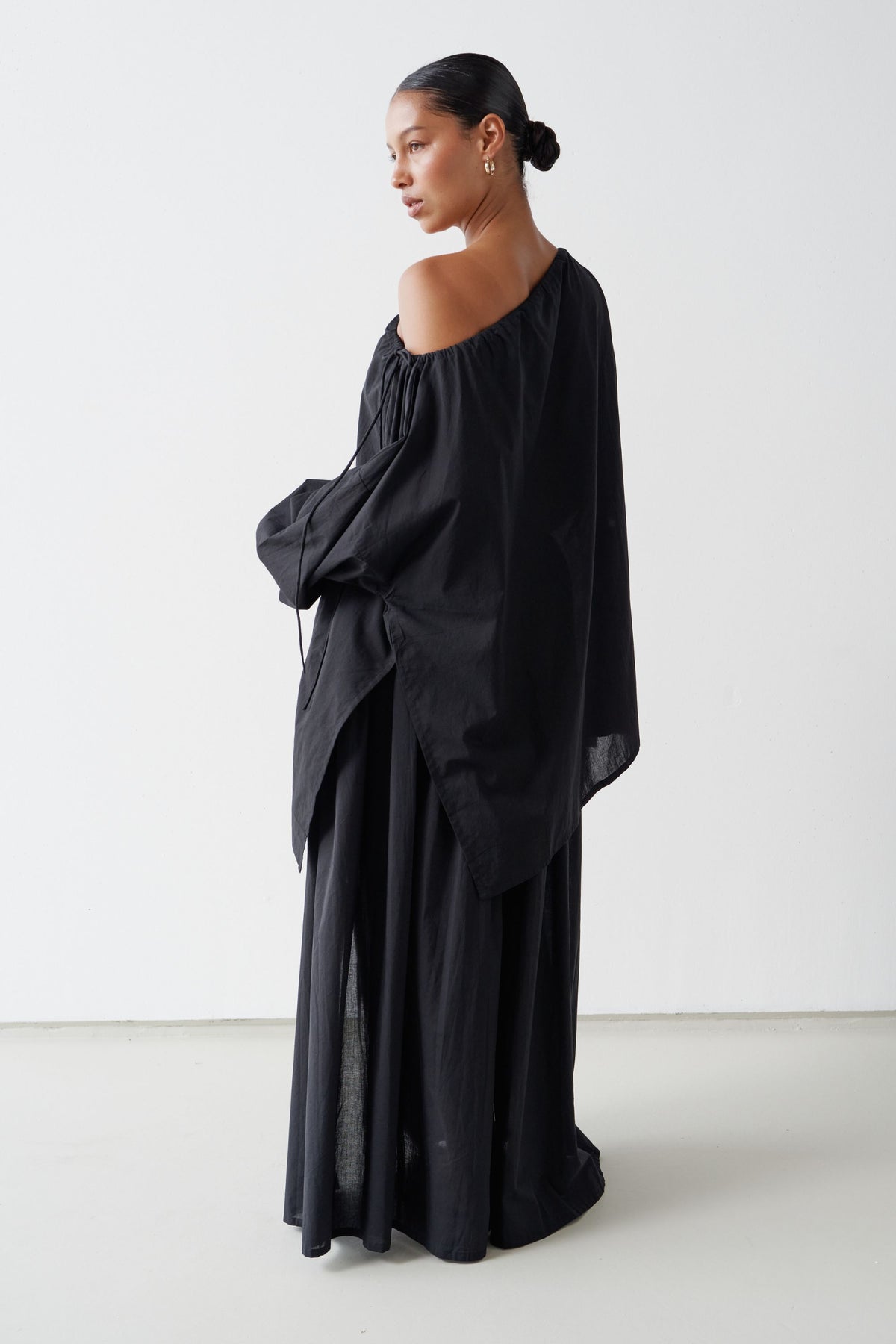 Back view of the Joss blouse and Maya skirt in Black